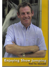 Cover of the DVD 'Enjoying Show Jumping with Tim Stockdale', featuring a photo of Tim Stockdale with his arms crossed, and a horse in the background.
